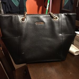 Black and gold Calvin Klein purse.